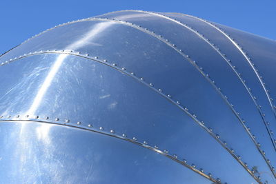 Low angle view of vapor trail against clear blue sky