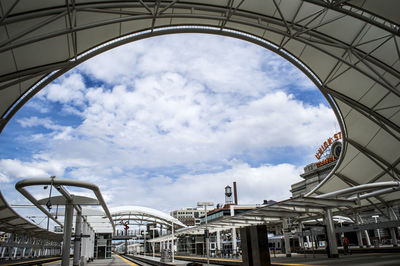 Low angle view of building against cloudy sky