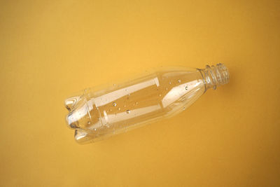 High angle view of glass bottle on table