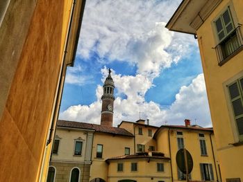 Low angle view of bell tower against sky