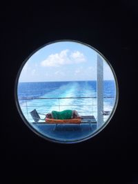 View of sea seen through window