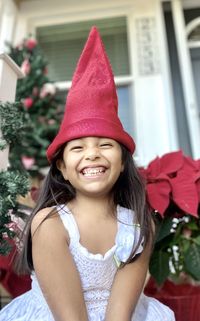 Portrait of young woman wearing hat