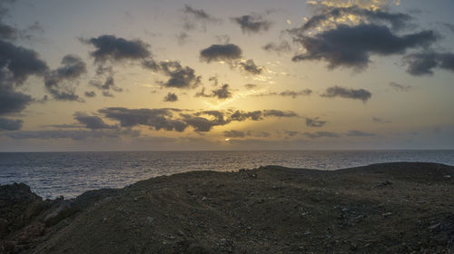 Scenic view of sea against sky at sunset
