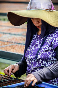 Side view of woman looking at outdoor cafe