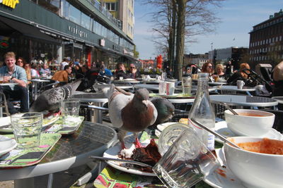 People at market stall in city