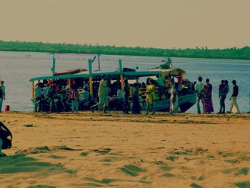 People relaxing on beach