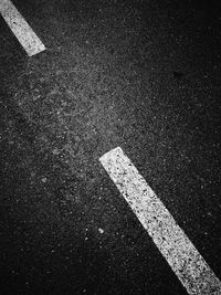 High angle view of arrow symbol on road