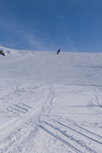 Scenic view of snow covered landscape against sky