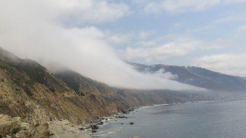 Scenic view of sea against cloudy sky