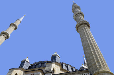 Low angle view of traditional building against clear blue sky