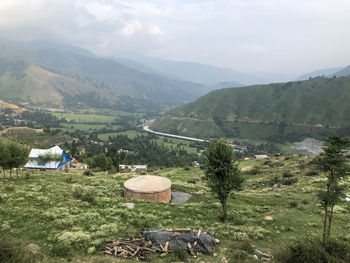 Scenic view of landscape and mountains against sky