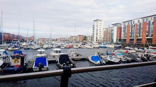 Boats moored at harbor