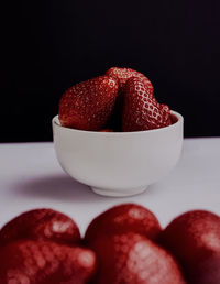 Close-up of strawberry over black background