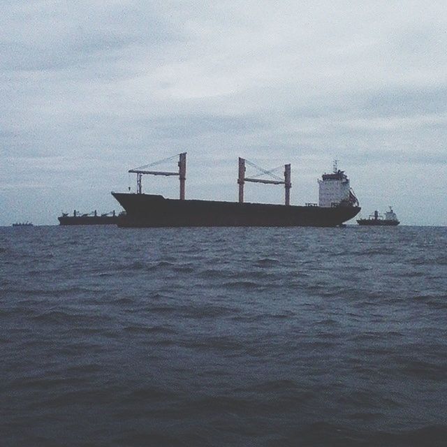 sea, water, nautical vessel, sky, transportation, waterfront, horizon over water, boat, mode of transport, tranquil scene, tranquility, scenics, nature, rippled, beauty in nature, cloud - sky, ship, outdoors, day, idyllic