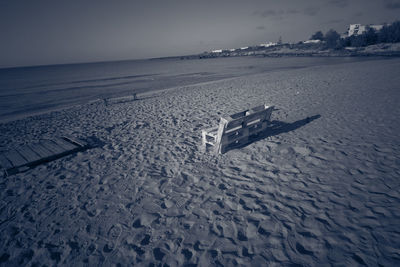 Scenic view of beach against sky during winter