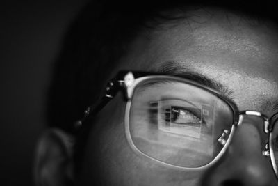 Close-up of man wearing eyeglasses