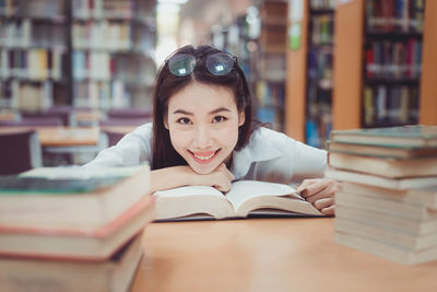 Portrait of young man reading book