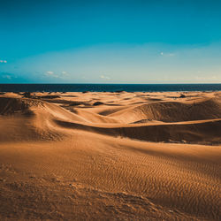 Scenic view of desert against sky