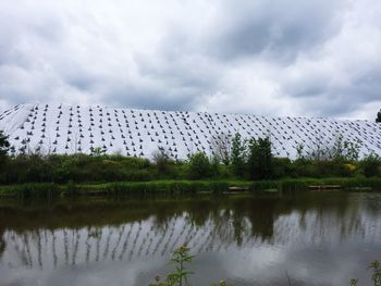 View of lake against cloudy sky