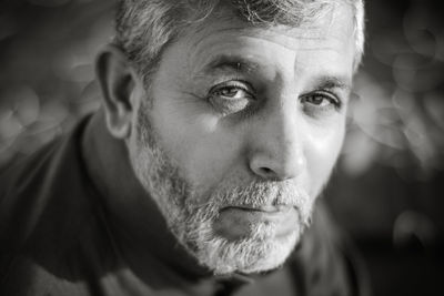 Close-up portrait of man looking away