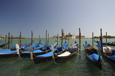 Boats moored at harbor