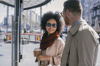 Couple in the city with takeaway coffee