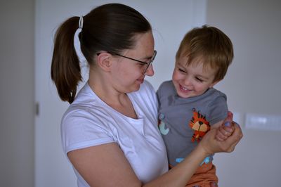 Close-up of mother with daughter at home