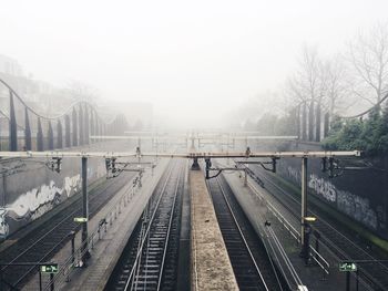 High angle view of railroad station platform in foggy weather