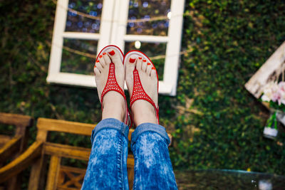 Low section of woman relaxing outdoors