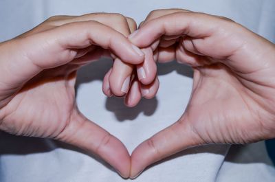 Close-up of man holding hands