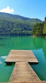 Scenic view of lake with mountains in background