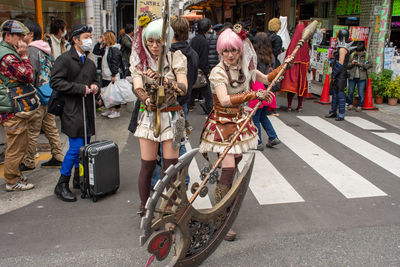 Group of people on road in city