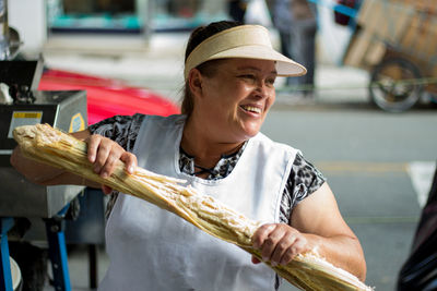 Close-up of man holding ice cream at market