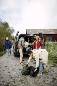 Rear view of two people on the road