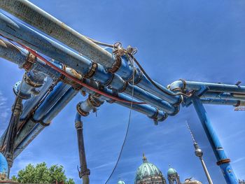 Low angle view of rollercoaster against sky