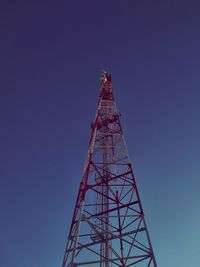 Low angle view of communications tower against sky