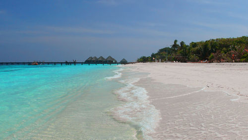 View of beach against blue sky