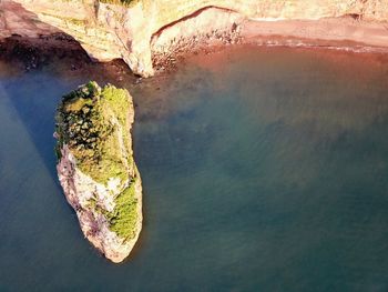 High angle view of rock in sea