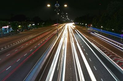 High angle view of light trails on highway at night