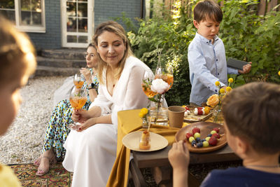 Portrait of smiling family having food at home