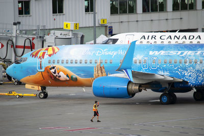 View of airplane at airport runway