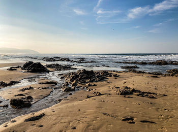 Scenic view of beach against sky