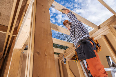 Low angle view of man standing on staircase