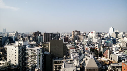 Aerial view of cityscape against sky