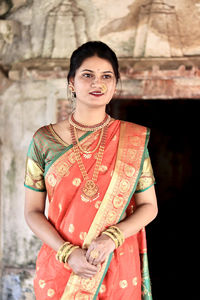 Young woman wearing sari looking away