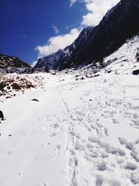 Scenic view of snow mountains against sky