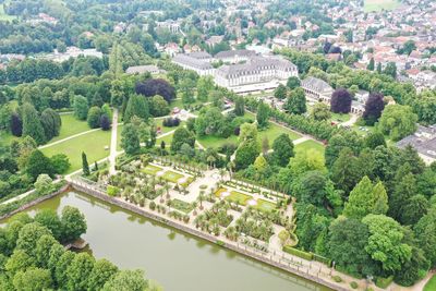 High angle view of buildings and trees in city