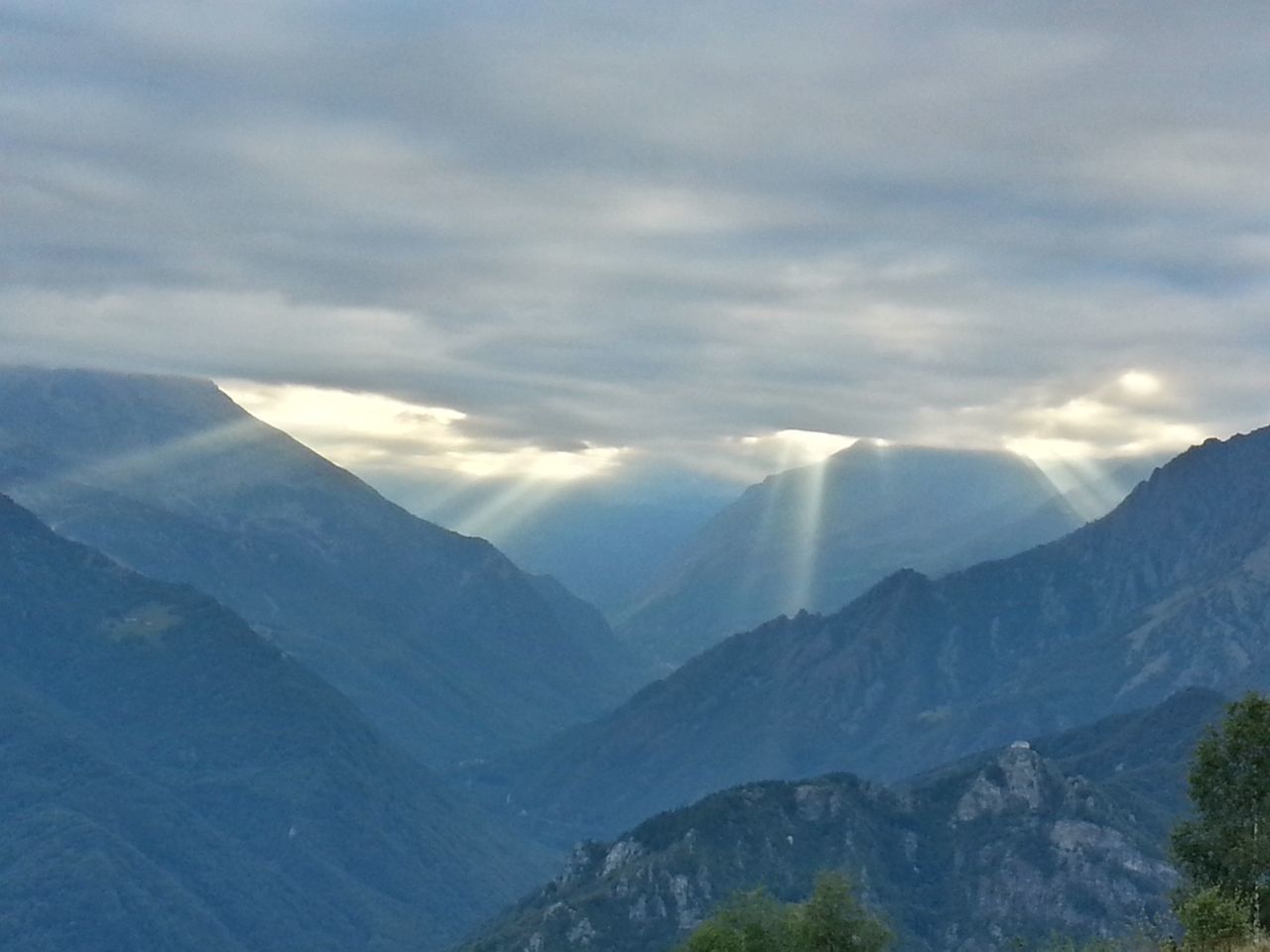 mountain, mountain range, tranquil scene, scenics, tranquility, beauty in nature, sky, landscape, cloud - sky, nature, idyllic, cloud, non-urban scene, majestic, cloudy, physical geography, sunlight, remote, outdoors, sunbeam