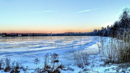 Scenic view of frozen lake against clear sky