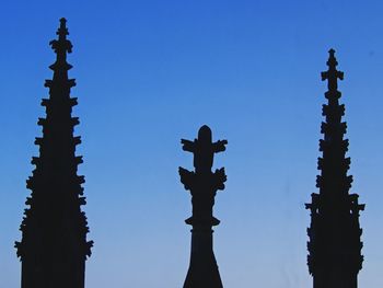 Low angle view of statue against clear blue sky